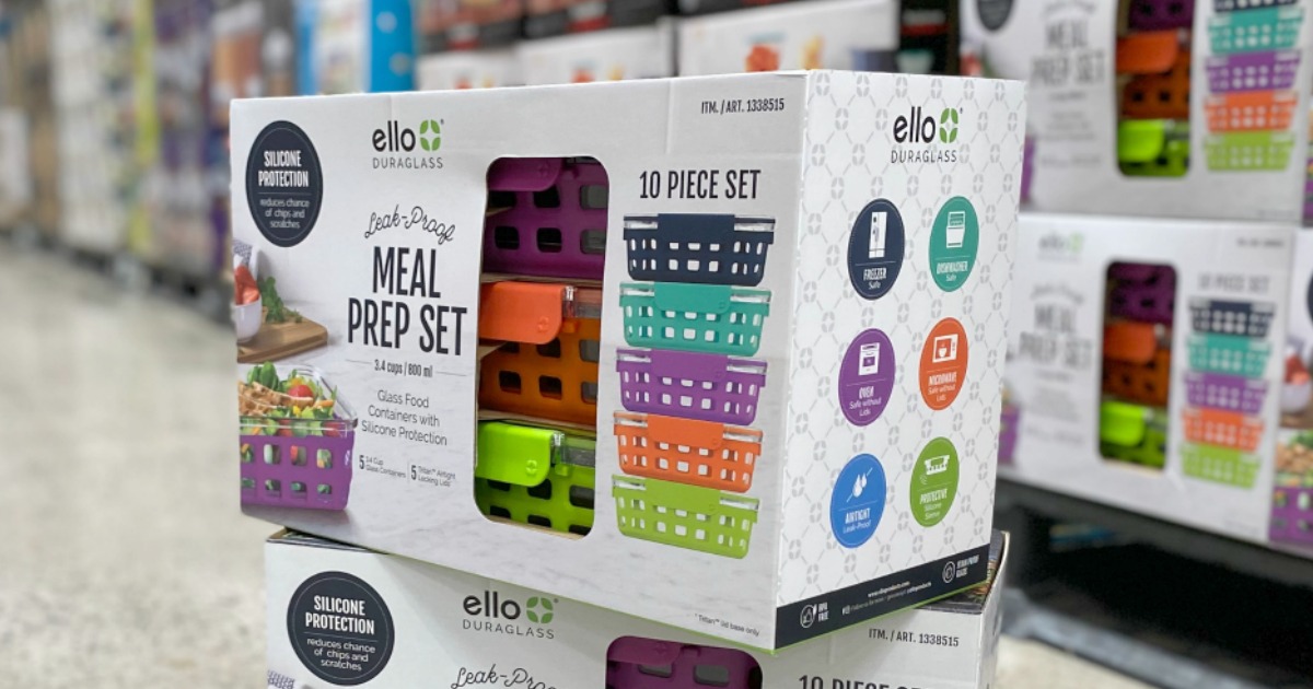 Large set of meal prep containers with lids in bright colors on floor stacked in-store