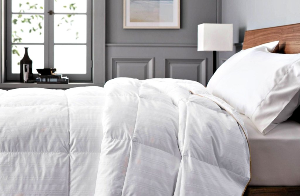 bed with a Fieldcrest Warmer Down Comforter in bedroom