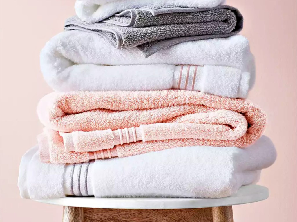 Fieldcrest towels folded and stacked on a stool