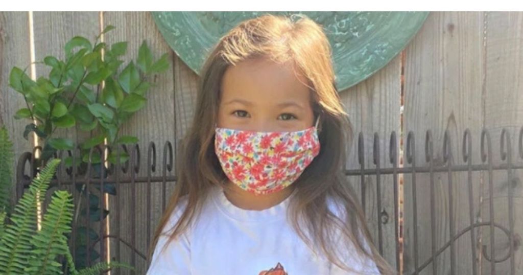 little girl wearing face mask