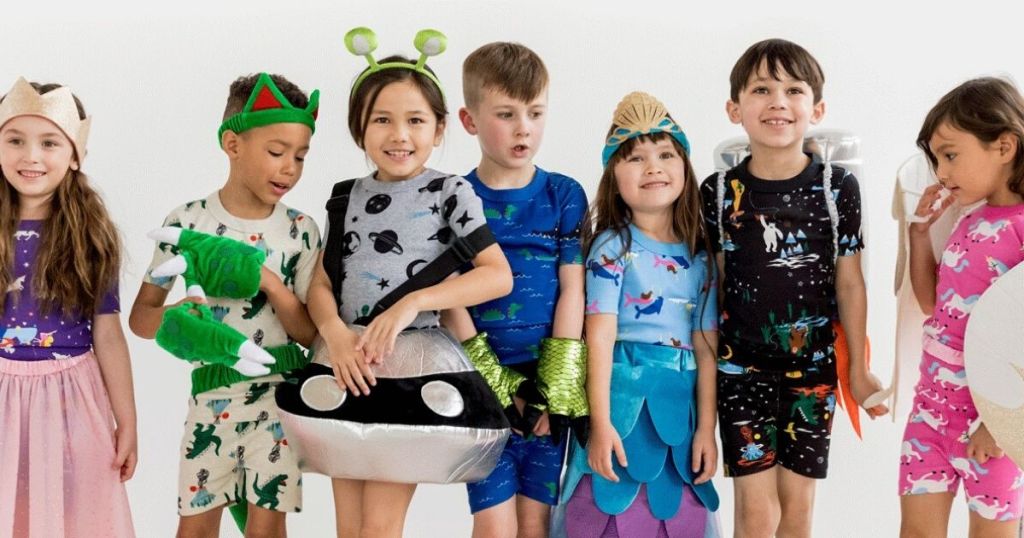 kids wearing pajamas and costumes
