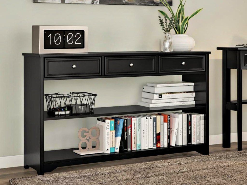 Home Decorator's Collection Oxford Storage Console Table in living room with books and decor