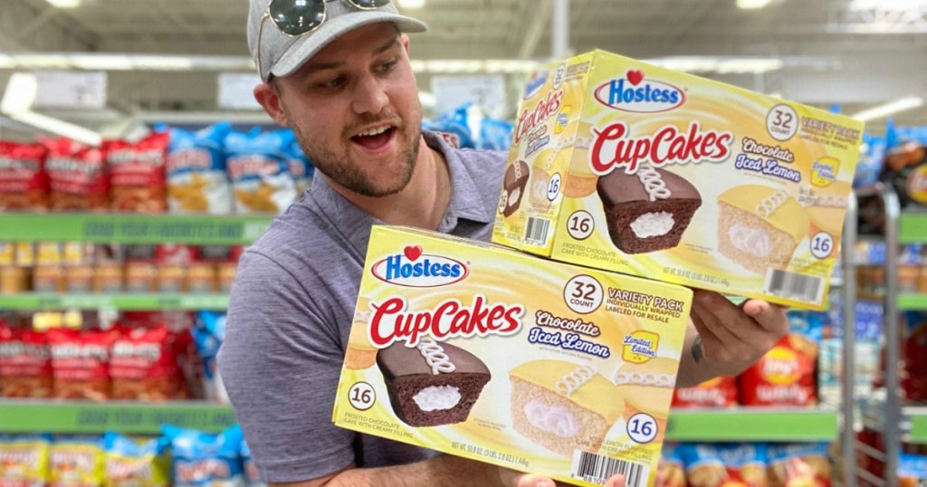 Hostess Cupcakes held by man in warehouse