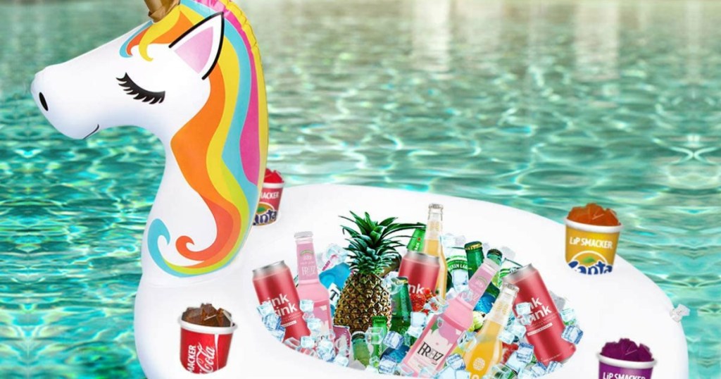 inflatable unicorn floating on a pool filled with beverages and snacks