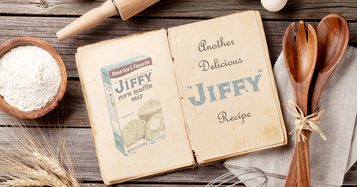 jiffy mix recipe book open on table surrounded by kitchen utensils