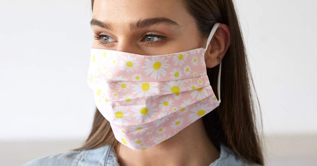 woman wearing Pink Ground & White Flower Cotton Face Mask