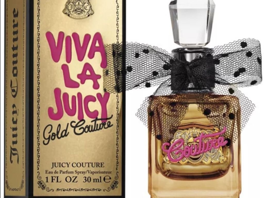 bottle of women's perfume with bow on it, next to packaging box