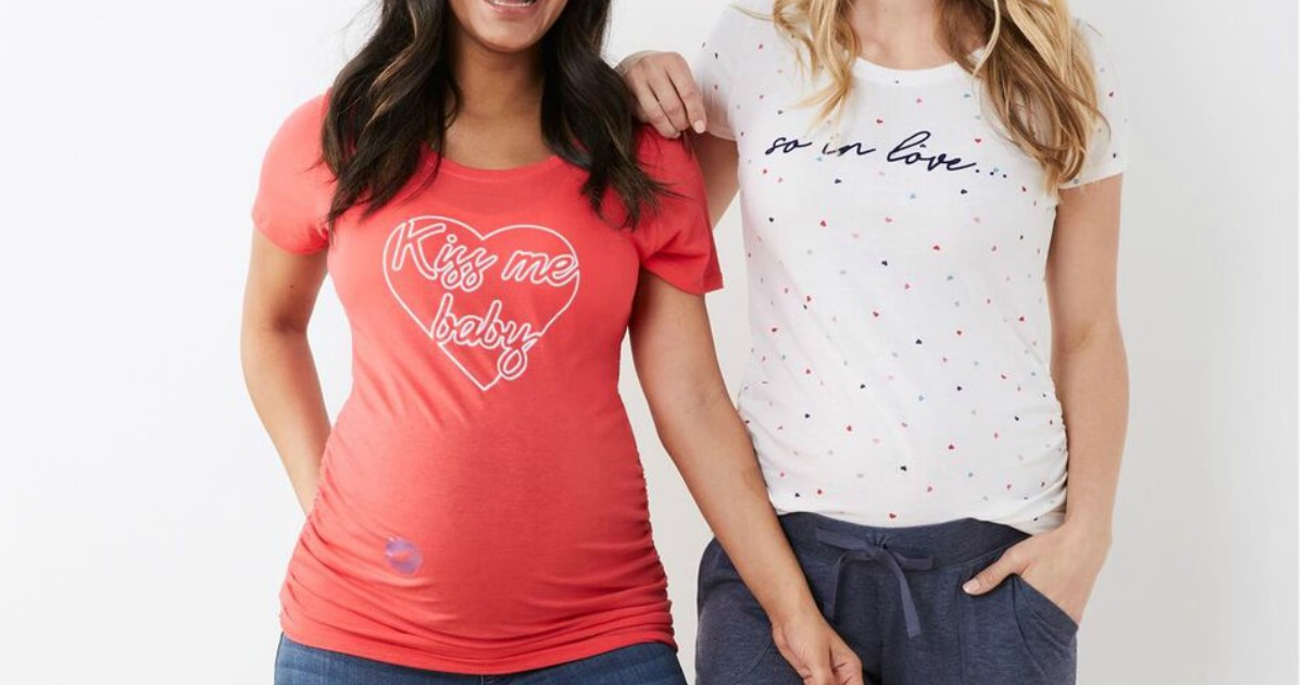 Two women wearing maternity shirts