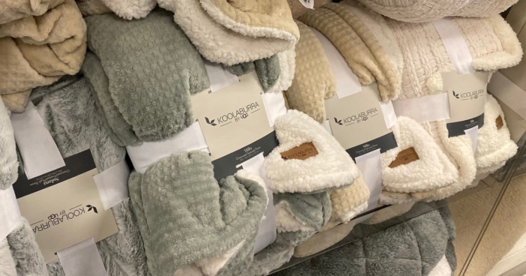 various throw blankets on store shelf