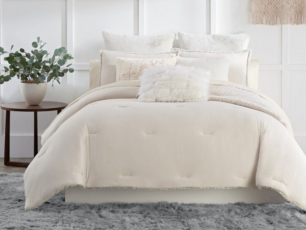 cream bedding set on bed
