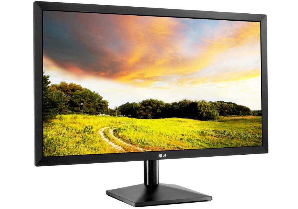 black computer monitor with field and sunset on screen