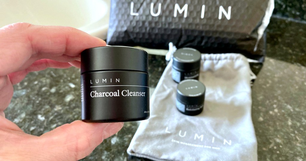 hand holding charcoal cleanser