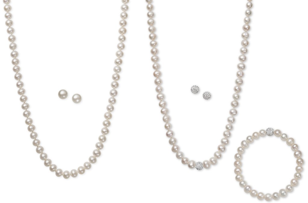 two white pearl necklaces with matching earrings and one matching pearl bracelet