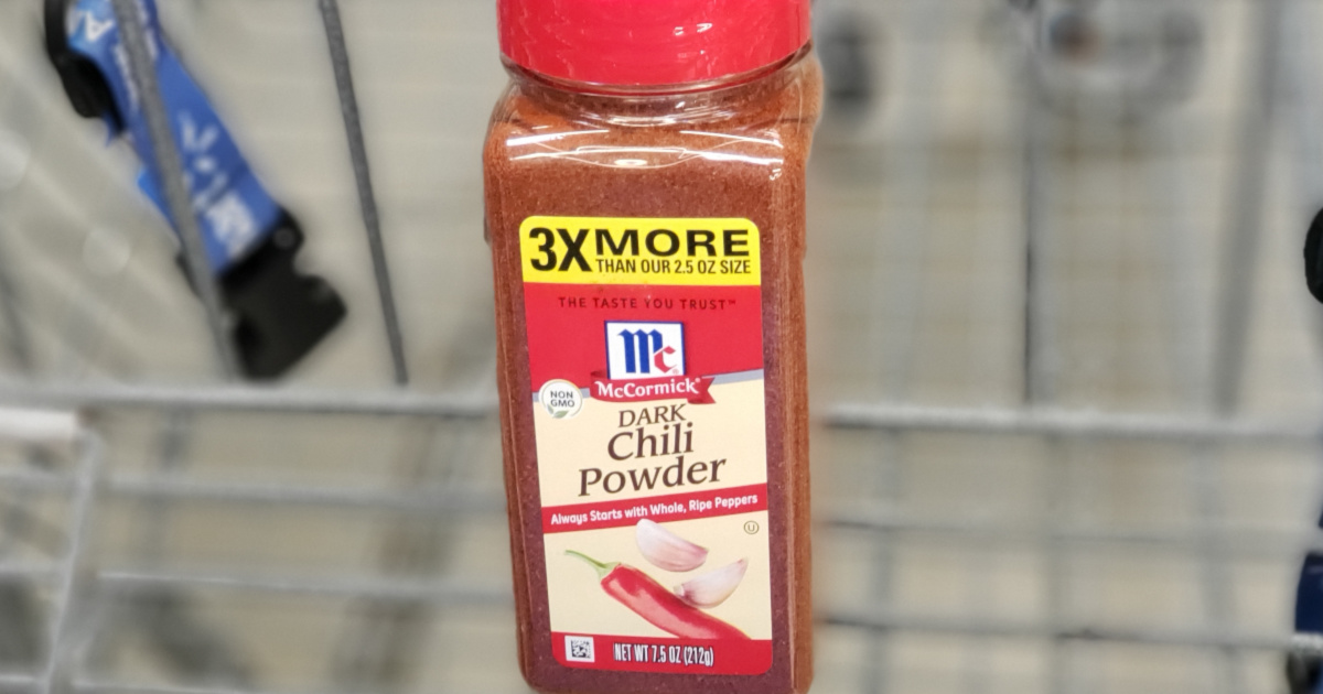 large bottle of dark chili powder in store cart