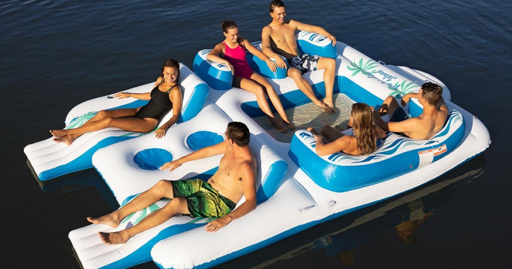 6 people on large raft in water