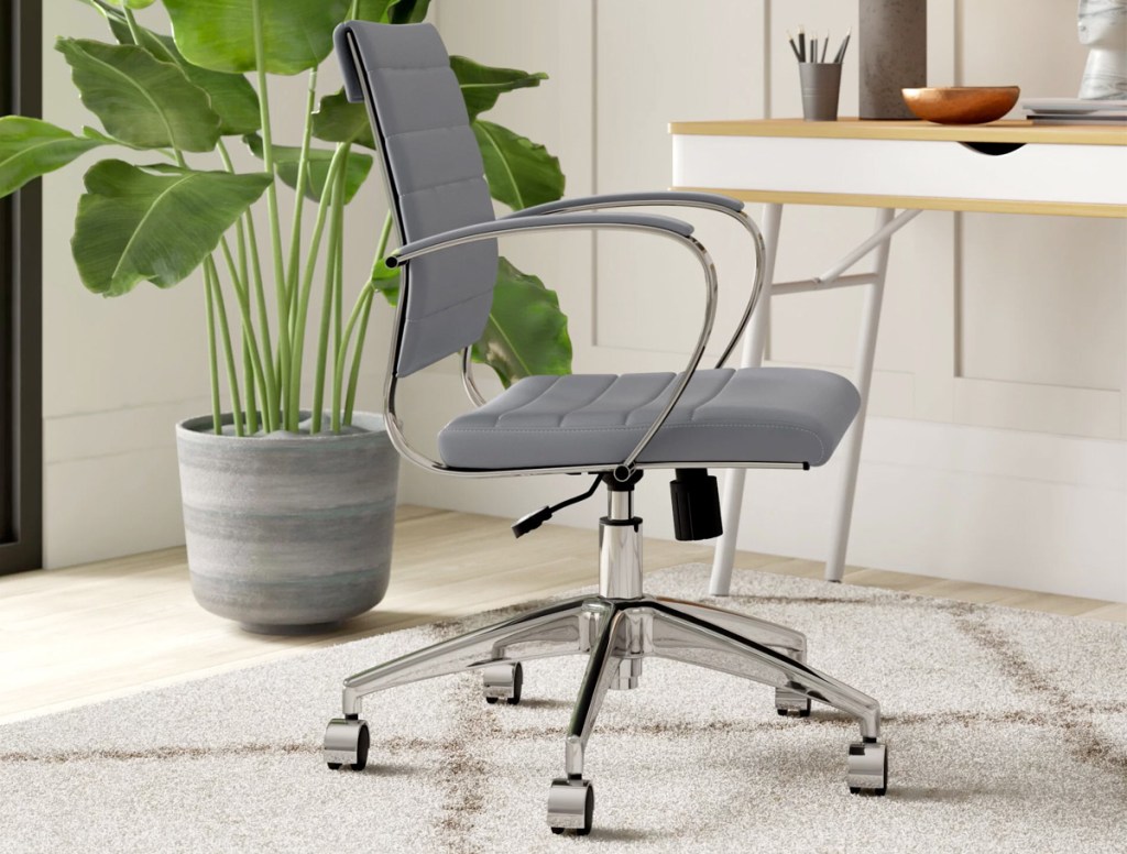 grey leather office chair with silver arms and legs in a home office