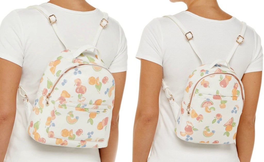 Two women wearing mom and daughter matching backpacks with fruity floral print