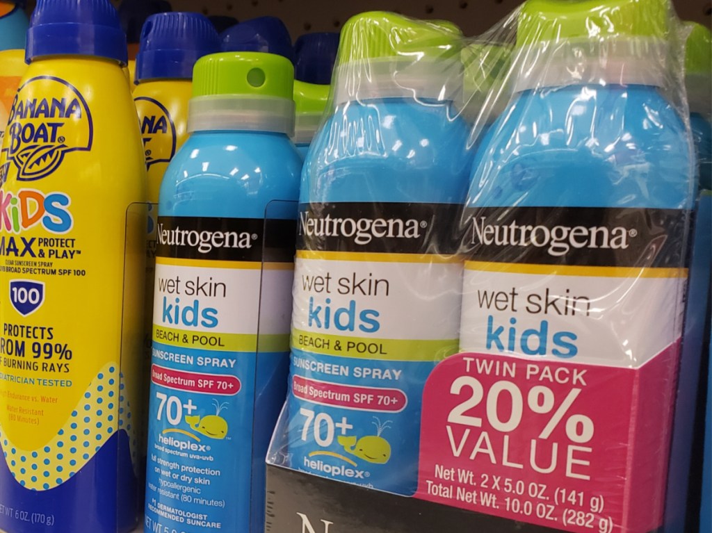 various bottles of kids sunscreen on store shelf