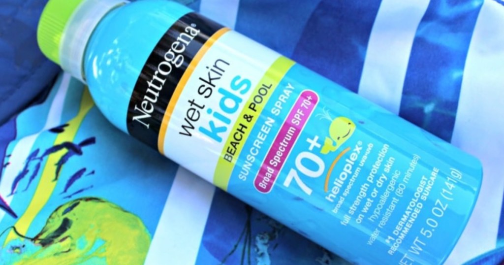 blue bottle of wet skin kids sunscreen on blue patterned surface