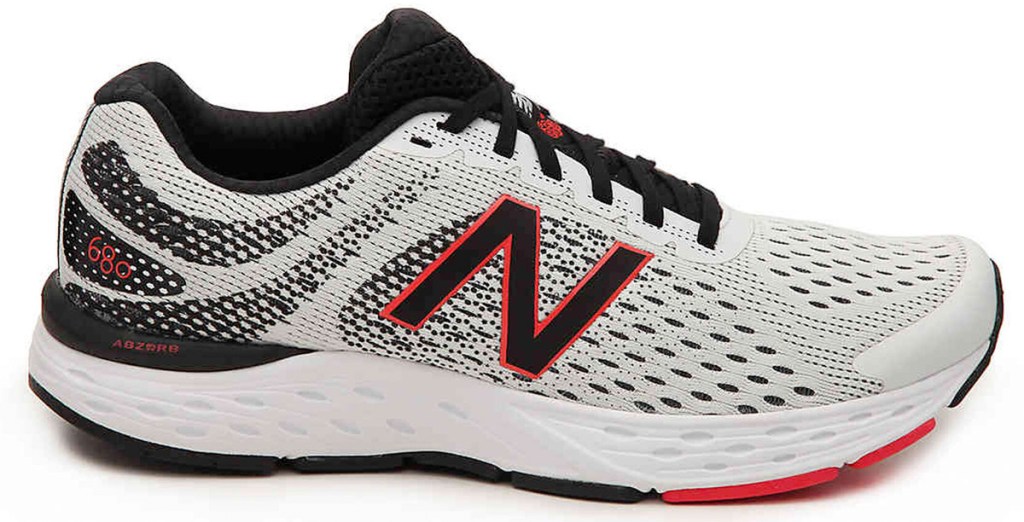 white mesh new balance running shoe with red and black accents