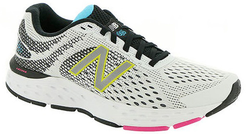 white mesh new balance running shoe with black, yellow, and pink accents