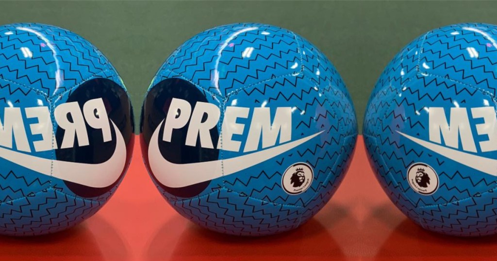 three blue soccer balls