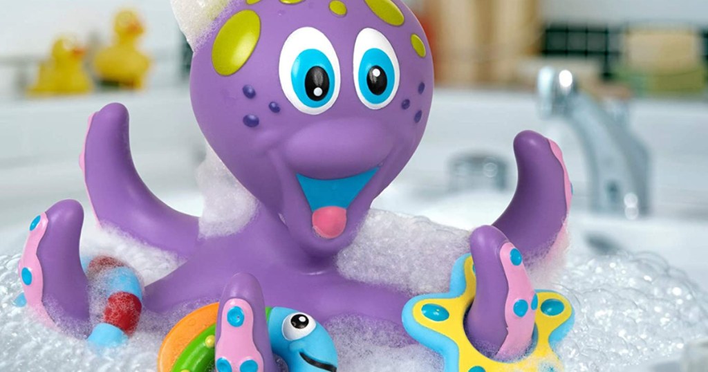 purple octopus toy in bubble bath