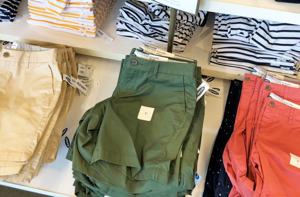 store display table of womens shorts in khaki, green, and red colors
