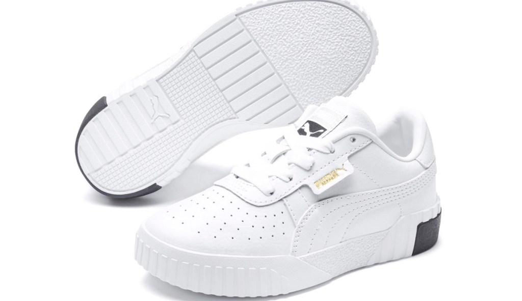 white leather kids sneakers with puma logo in gold near laces