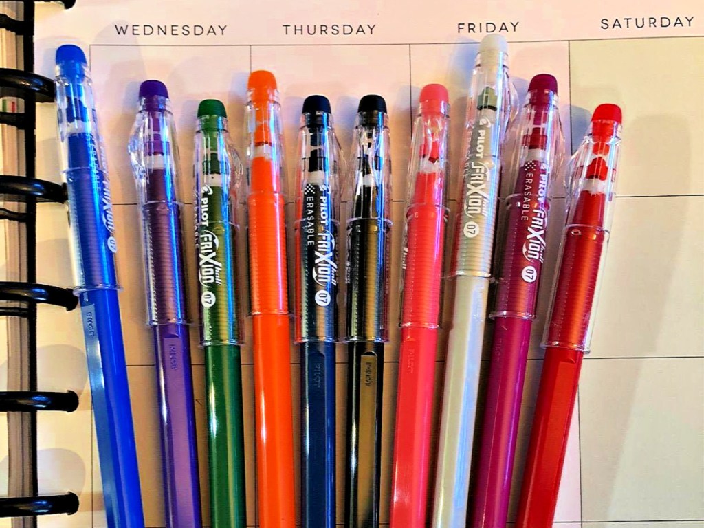 Pilot FriXion ColorSticks Erasable 10-Pack Gel Pens laying on planner