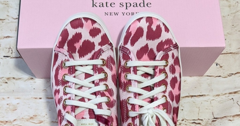 pink leopard print sneakers on top of pink kate spade shoe box