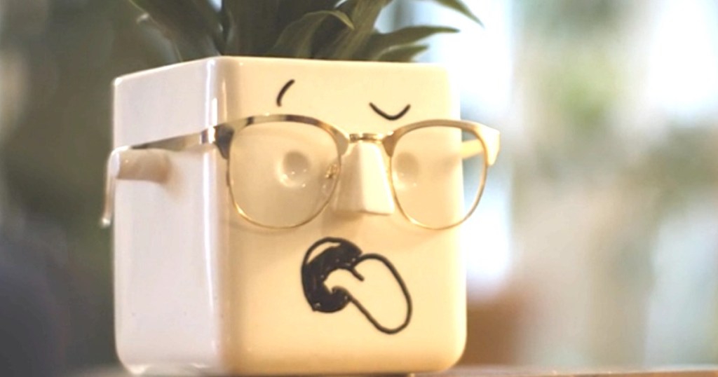 face planter with tongue sticking out and glasses on