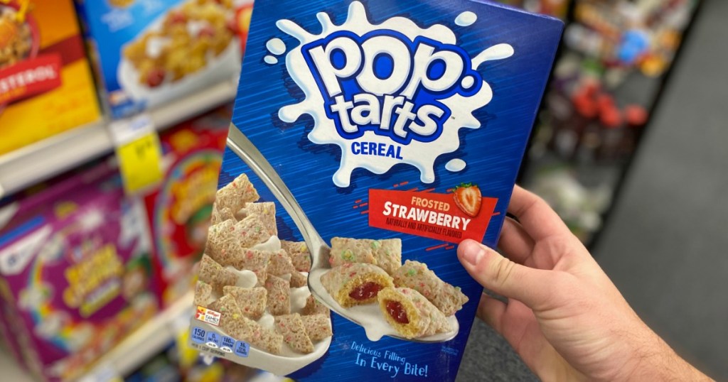 hand holding box of Pop-Tarts Cereal