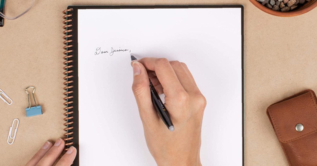 hand writing Dear Jessica in cursive on paper