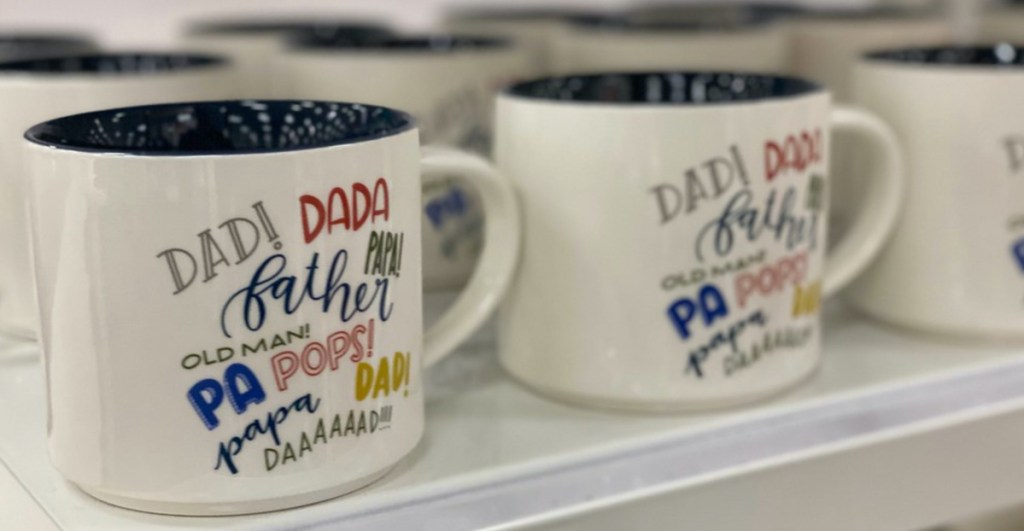 white Father's Day theme mugs on store shelf