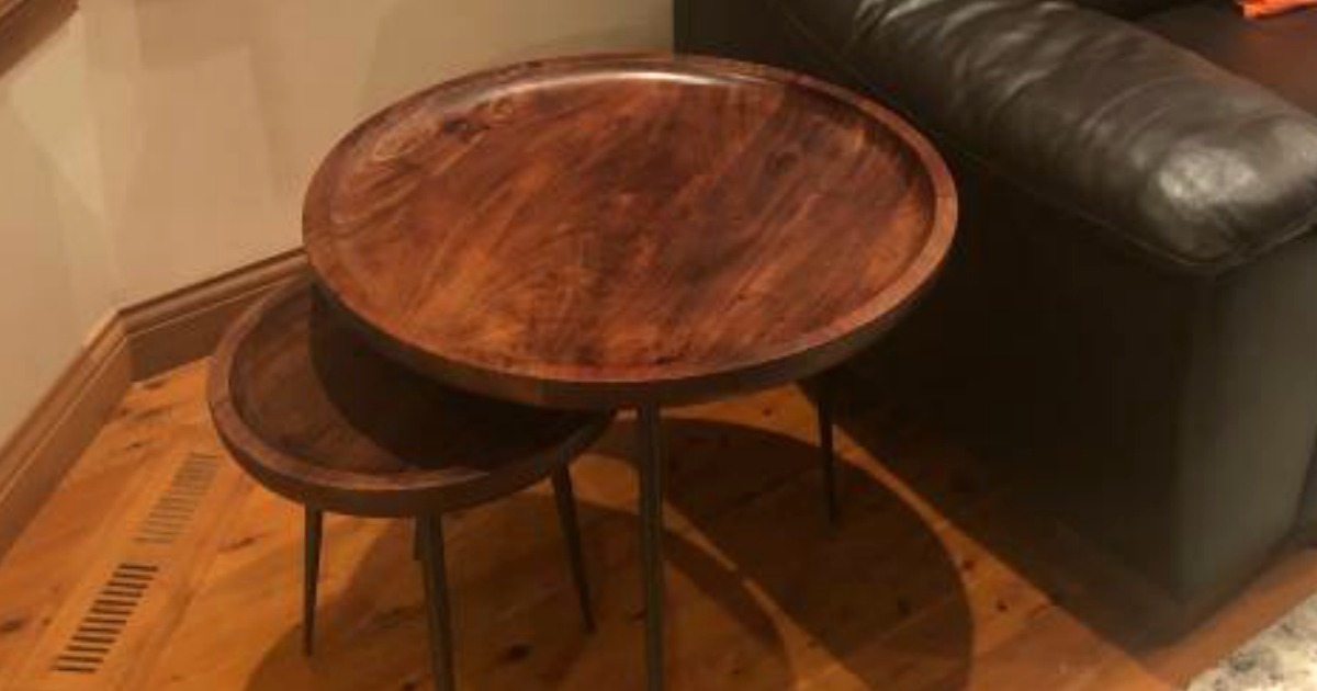 set of round nesting tables in living room next to couch
