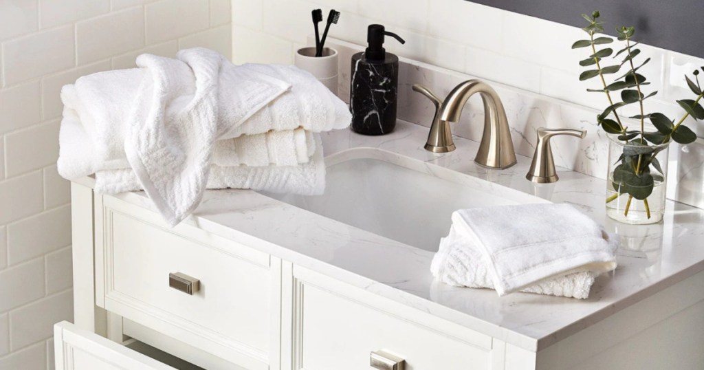 Scott Living White Bath Towels on white bathroom vanity 