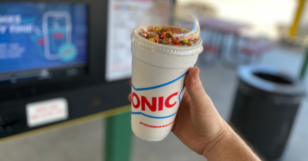 person holding a blast ice cream drink from Sonic