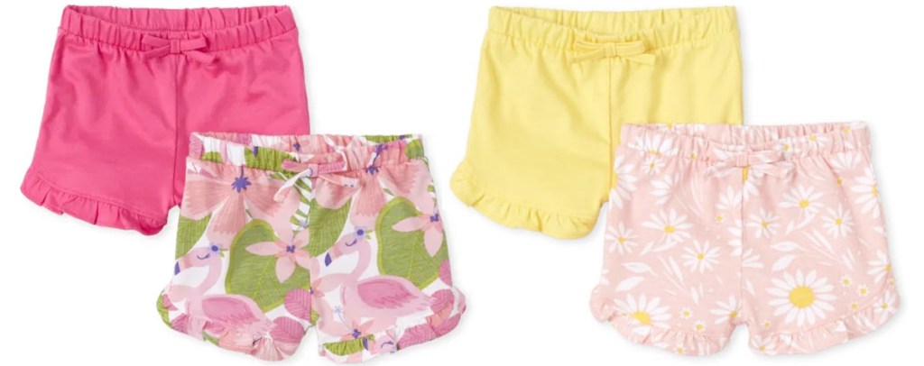 two 2-packs of baby girls ruffle shorts in pink, pink floral, yellow, and light pink daisy print