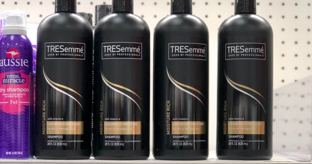4 bottles of TRESemme moisture rich shampoo bottles on store shelf