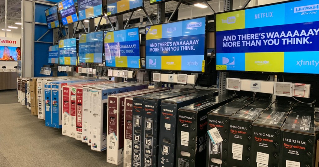 TVs at best buy many tvs on the wall and in boxes