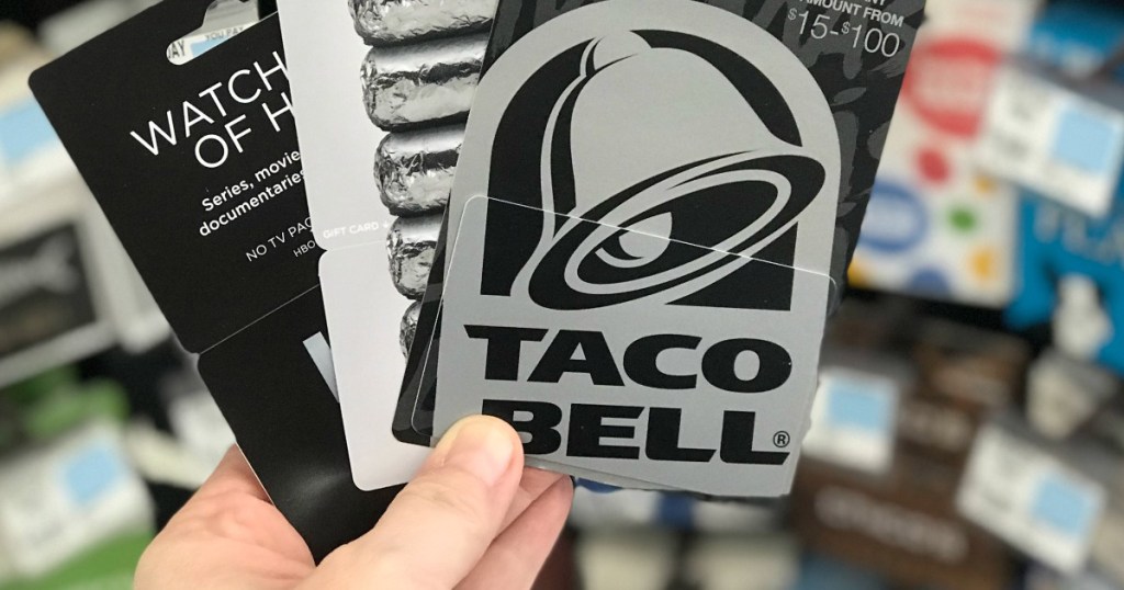 Man holding Taco Bell gift card