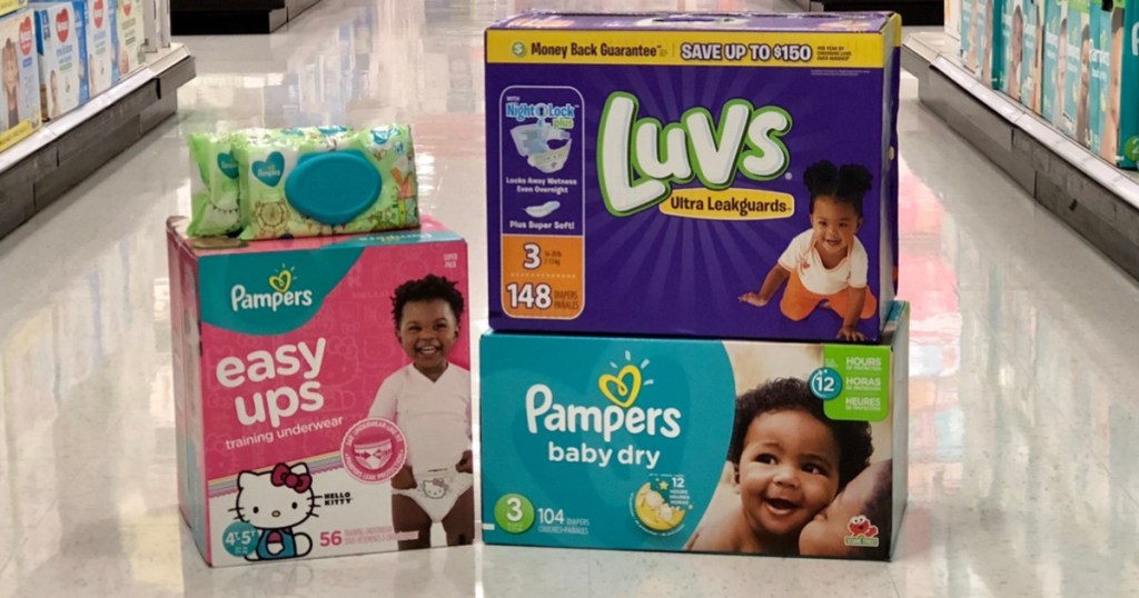 boxes of diapers and training underwear, and baby wipes on floor in store
