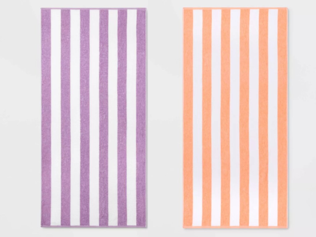 2 striped beach towels sitting next to each other