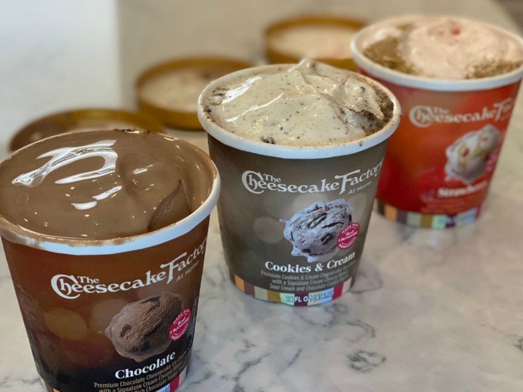 three varieties of The Cheesecake Ice Cream on a kitchen countertop