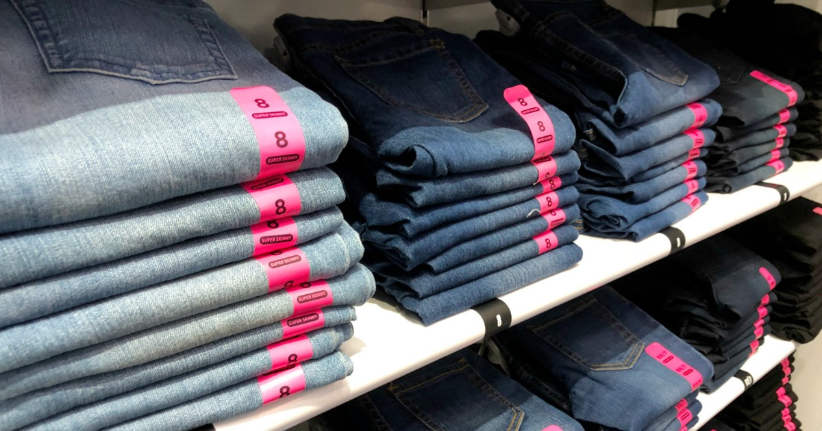 store display shelves full of different washes of kids jeans