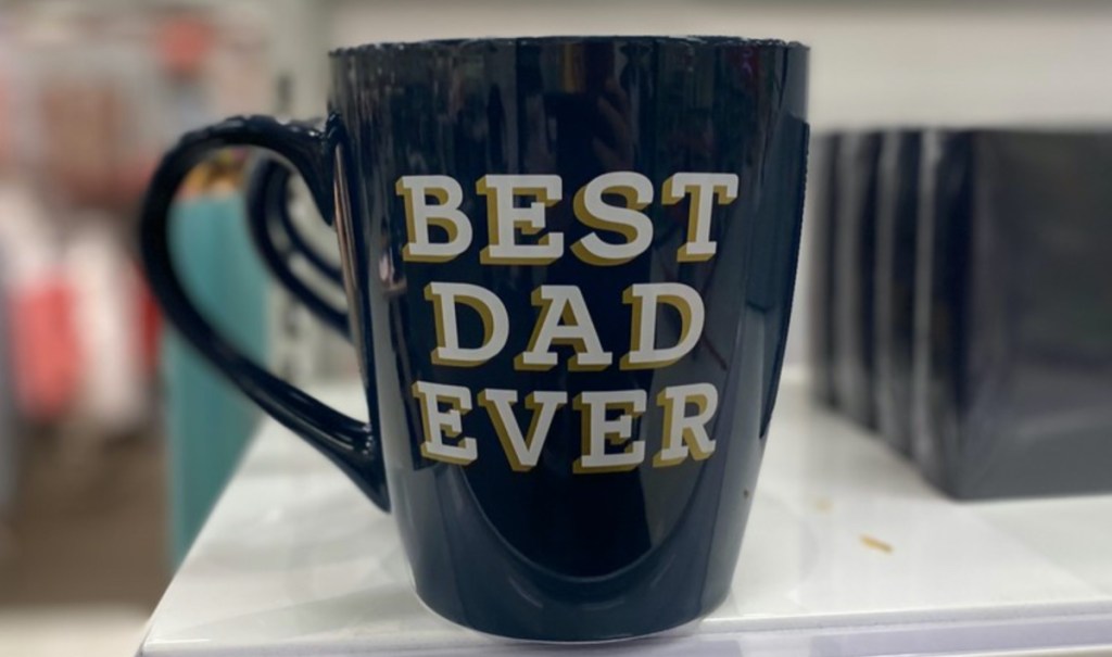 large blue "Best Dad Ever" mug on store shelf