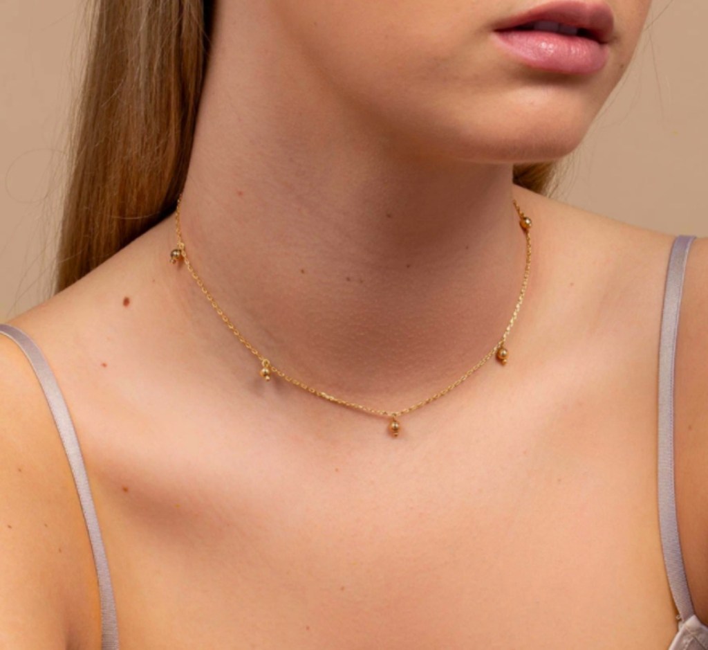 lady wearing an uncommon james necklace