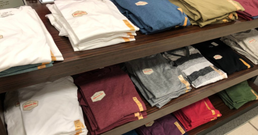 men's tees on table in store