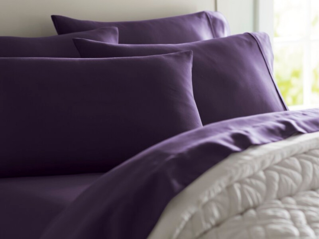 dark purple sheets on bed